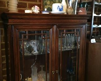 China cabinet with glassware and china.
