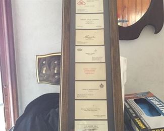 Framed vintage business cards.