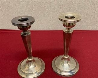Pair of sterling candleholders https://ctbids.com/#!/description/share/337625