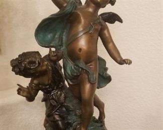 Bronze cherub statue signature