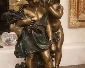 Bronze boy and girl statue signed by artist