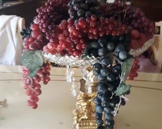 Antique fruit bowl with artificial grapes