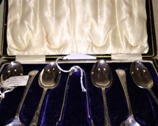 Silver spoons in case
