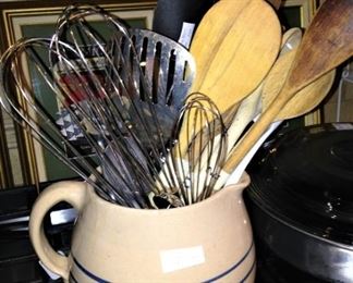 Pitcher full of utensils