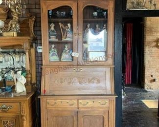 Lot 807 Antique Oak Cabinet 98 x 42 x 19- Cabinet has a Drop Front, 2 Drawers, 4 Doors. 5 Pieces Carnival Glass, 10 Figurines.