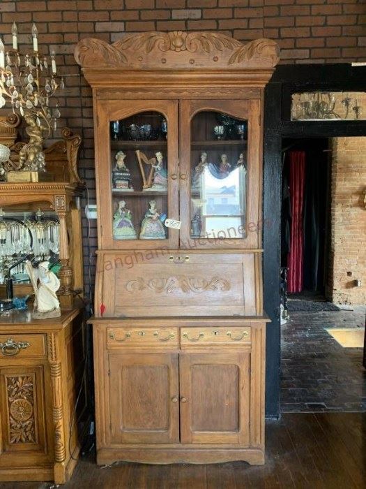 Lot 807 Antique Oak Cabinet 98 x 42 x 19- Cabinet has a Drop Front, 2 Drawers, 4 Doors.  5 Pieces Carnival Glass, 10 Figurines.