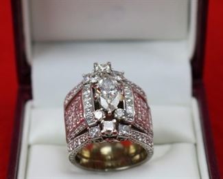 Lot 832 Ring-14K White Gold Band With Center Stone 2.01K- Ladies multi rings  put together, center ring is 18k white gold has a 2.01ct Marquise center diamond I/SI2 GIA cert#1162577946 with 50 side princess shape diamonds @ 2.90cttw G/Si1, 20 round diamonds @ .18cttw G/SI1i quantity of 4 round diamonds @ .13ct each G/SI2 for a total weight of .52cttw.  On each side of the center ring is a 14k white gold 3 stone ring each center is 3/8ct princess shape HI/I2 and 2 princess shaped diamonds @ 3/8cttw HI/I2 with 10 round diamonds @ 1/5cttw HI/I2, for a total for both rings @ 2.00cttw.