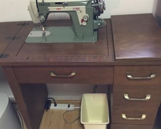 sewing machine in cabinet