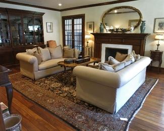 Living Room: Pair of Down Silk Sofas; Large Mahogany Library; Antique Kirman Rug, 11 x 13'8