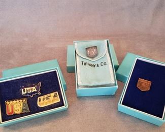 Trading pins made by Tiffany & Co. center is sterling
