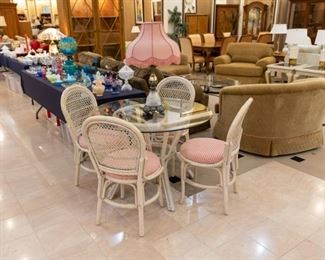 What an adorable wicker glass table/chair set with pink cushions!