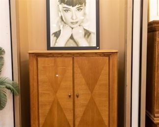Love the Audrey Hepburn picture:)  Very nice entertainment center with drawers and shelves.