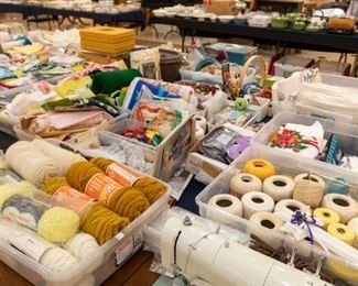 Lots of yarn, fabric,  and sewing accessories.