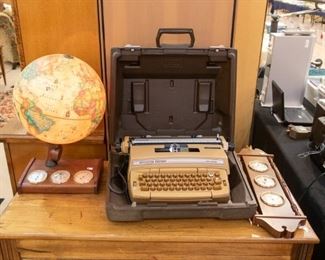 Lighted Globe and Smith Corona Typewriter