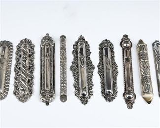 A COLLECTION OF NINE SILVER MEZUZAH COVERS