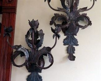 Hand wrought metal sculpture sconces.