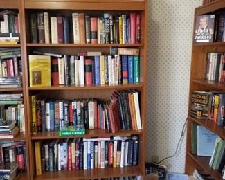 Bookshelf filled with books, hundreds more available