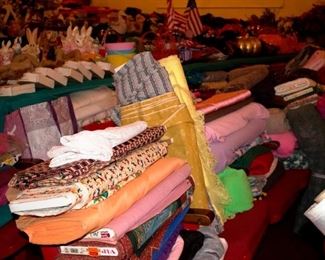 Bolts and bolts and stack of fabric. Very inexpensive, priced to sell!