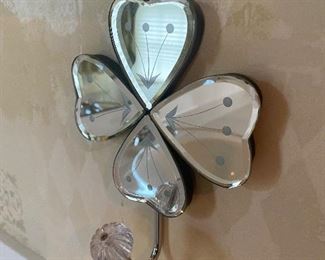 One of two mirrored towel hooks