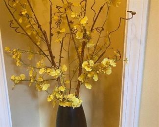Gorgeous, curvy wood vase with forsythia branches
