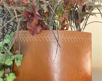 Leather-look vase with flower arrangement