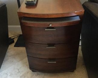 Bow front end table with pull out shelf