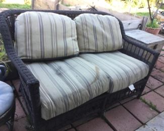 Settee with cushions need clean but sunbrella fabric good, matches table and chairs