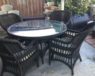 Umbrella table and four chairs matches loveseat