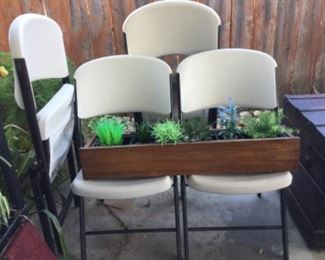 Four outdoor heavy duty plastic yet lightweight for moving, faux plants in planter box