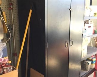 One of two large black storage metal cabinets