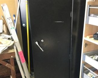 Second of two black metal locking cabinets