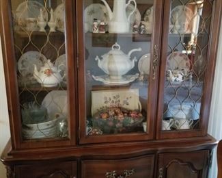 Breakfront filled with old Bone China Teacup / saucer and matching plate sets.... 