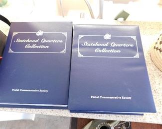 A complete set of statehood quarters, with info sheets and binders.