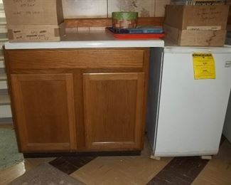 oak storage cupboard and small freezer