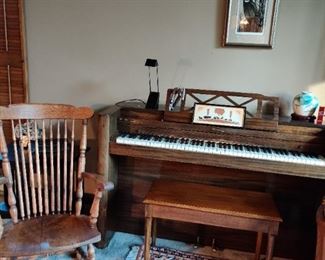 "minipiano" and oak rocking chair. Rug is wool made for Frederick and Nelson, cost 375. new