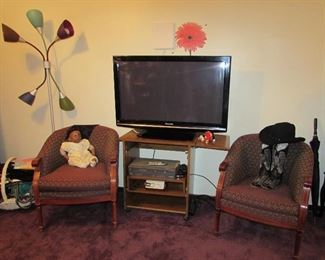 Rounded Back Chairs, TV, Magnavox DVD, Cowboy Boots and Hat