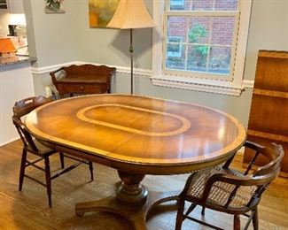 Dining room table with one leaf insert, has two more leaves.  Table $495.  Pair cane chairs $80.  Seats 12.