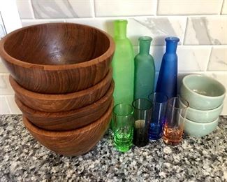 Glass bottles and wooden bowls
