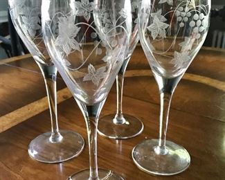 Four etched crystal glasses 9.5" tall $12