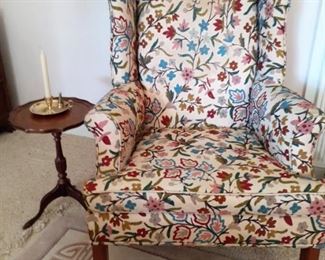 Embroidered wingback chair with matching stool