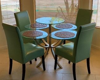 Contemporary Steel & Glass Pedestal Table	36x52x52in	HxWxD
4pc Teal Contemporary Chairs	
