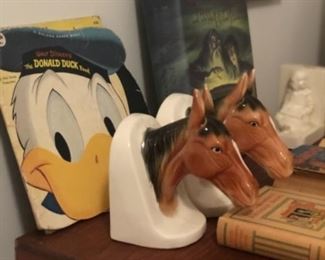 Horse head bookends and vintage children’s books.
