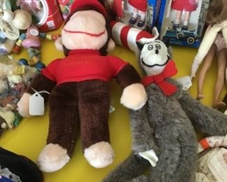 Curious George and the Cat in the Hat plush figures.