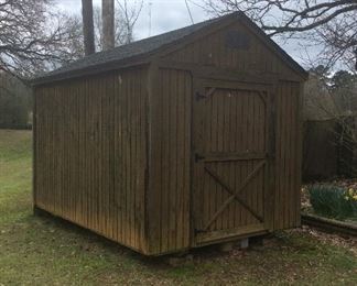 New Condition 8’ x 12’ storage shed. Treated wood & Shingle roof.