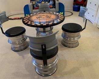 Game table made from tire rims, one of a kind!!! Perfect for your man-cave.  Come early this will be the first to go!