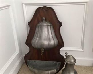 Pewter Water Dispenser with Trough Hanging and Pewter Liquid Dispenser with Decorative Fish feet. https://ctbids.com/#!/description/share/340962