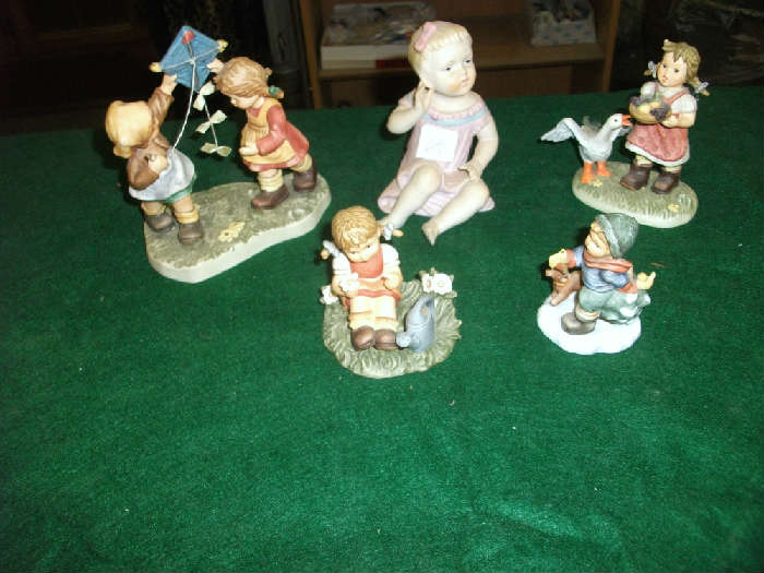 4 Goebels & a neat little girl figurine.