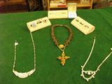 Other than the 2 Rhinstone necklaces, there are 2 10kt. gold rings & several Sterling ones. Bet u don't know which pc. is worth the most money.