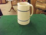 LG. RING STONEWARE PITCHER. HAS MINOR CRACK ON EACH SIDE OF TOP