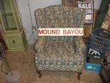 The sign is for a Ms. town that at 1 time was all black. Gorgeous wingback chair.